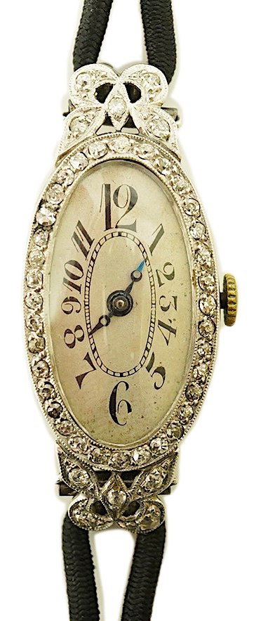 A lady's 1920's/1930's platinum and diamond cluster set cocktail watch